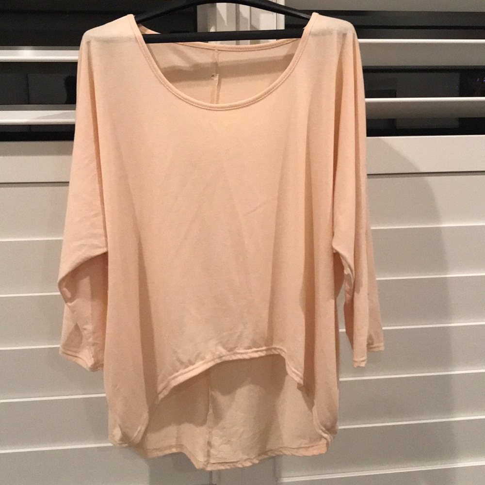 Cream colored top, high-low hem